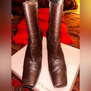 Dark brown square toe 3 inch heel boots with zipper on the inside.